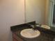 Bathroom sink with granite countertop and large mirror at 1973 Portofino Meadows Blvd, Orlando, FL 32824