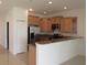 Kitchen featuring stainless steel appliances, granite counters, light cabinets, and a breakfast bar at 1973 Portofino Meadows Blvd, Orlando, FL 32824