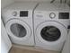 This laundry room features a Samsung washer and dryer, providing efficient laundry solutions at 1973 Portofino Meadows Blvd, Orlando, FL 32824