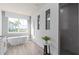 Modern bathroom featuring a soaking tub, glass shower, and large picture window at 2135 Weatherly Way, Orlando, FL 32820