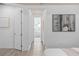 A hallway leads to the main bathroom featuring wood-style tile floors at 2135 Weatherly Way, Orlando, FL 32820