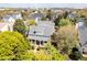 Overhead view of a charming home with a welcoming front porch and a landscaped yard in a desirable neighborhood at 2161 Snow Rd, Orlando, FL 32814