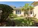 Landscaped backyard featuring a well-maintained lawn and lush greenery providing a serene outdoor space at 2161 Snow Rd, Orlando, FL 32814
