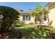 Serene backyard with lush landscaping and a well-manicured lawn at 2161 Snow Rd, Orlando, FL 32814