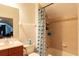 Well-lit bathroom with a shower-tub combo and stylish vanity at 2161 Snow Rd, Orlando, FL 32814