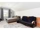 This bedroom features a futon, a twin bed, a ceiling with an angle and neutral walls at 2161 Snow Rd, Orlando, FL 32814