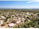 Aerial view of a beautiful neighborhood, surrounded by trees and a large lake at 2253 Lake Pointe Cir, Leesburg, FL 34748