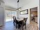 Bright dining room with a modern light fixture and sliding glass door at 2253 Lake Pointe Cir, Leesburg, FL 34748