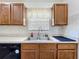 Close up on the stainless steel kitchen sink and white tile backsplash at 2253 Lake Pointe Cir, Leesburg, FL 34748