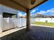 A covered patio overlooking the backyard at 2707 Barnsley Ln, Kissimmee, FL 34744