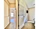 Hallway view of carpet, neutral walls, a bedroom, and a closet at 2707 Barnsley Ln, Kissimmee, FL 34744