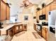 This is an inviting kitchen, featuring stainless appliances, neutral countertops and light cabinets at 2707 Barnsley Ln, Kissimmee, FL 34744