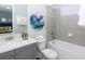 Full bathroom with white cabinets, chrome fixtures, and shower and tub combination at 288 Auburn Ave, Kissimmee, FL 34747