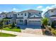 Beautifully landscaped two-story home features a paved driveway and welcoming entrance at 288 Auburn Ave, Kissimmee, FL 34747