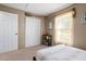 Bedroom with neutral walls, a closet, a window, and a black platform bed at 288 Garland, Deltona, FL 32725