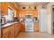 Kitchen featuring wooden cabinetry and essential appliances at 288 Garland, Deltona, FL 32725