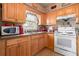 Functional kitchen featuring wooden cabinetry and essential appliances at 288 Garland, Deltona, FL 32725