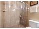 Bathroom shower with tiled walls, a clear curtain, and a built-in shelf for toiletries at 288 Garland, Deltona, FL 32725