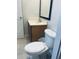 Cozy bathroom features a standard toilet, sink, and vanity with essential fixtures at 3018 Red Ginger Rd, Kissimmee, FL 34747