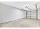 Garage with concrete floors and large white walls at 3288 Brewster Dr, Kissimmee, FL 34743