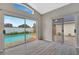 Bright living room with sliding glass doors leading to the pool and modern gray floors at 3288 Brewster Dr, Kissimmee, FL 34743