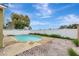 Backyard pool view surrounded by a white fence and brick pavers at 3288 Brewster Dr, Kissimmee, FL 34743