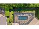 This aerial shows the backyard pool with a screened enclosure and mature landscaping at 3369 Park Grove Ct, Longwood, FL 32779