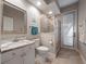 Bathroom featuring a white vanity with marble top, enclosed shower, and private entrance at 3369 Park Grove Ct, Longwood, FL 32779