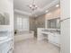 Bright bathroom with double sinks, a soaking tub and a separate shower at 3369 Park Grove Ct, Longwood, FL 32779