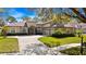 Inviting home with a barrel tile roof, manicured landscaping, and an attached two-car garage at 3369 Park Grove Ct, Longwood, FL 32779