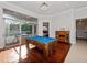 Game room with pool table and view to outdoor living space with seating at 3369 Park Grove Ct, Longwood, FL 32779