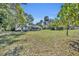 Large lot featuring well-maintained lawn, house, and mature trees at 390 Lake Geneva Rd, Geneva, FL 32732