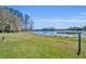 The lush green backyard leads to a beautiful lake with a view of nature all around at 390 Lake Geneva Rd, Geneva, FL 32732