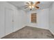 Bedroom featuring neutral carpet, window, and closet with door at 390 Lake Geneva Rd, Geneva, FL 32732