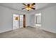 Bedroom featuring closet and doorway with curtains and ceiling fan at 390 Lake Geneva Rd, Geneva, FL 32732