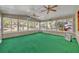 Florida room with lots of light and many windows showcasing backyard landscaping at 390 Lake Geneva Rd, Geneva, FL 32732