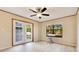 Bright bedroom featuring French doors, a ceiling fan, laminate flooring, and a window at 4029 Cool Water Ct, Winter Park, FL 32792