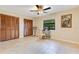 Bedroom featuring closets, a desk, chair, and a ceiling fan at 4029 Cool Water Ct, Winter Park, FL 32792