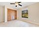 Bedroom featuring a closet, ceiling fan, and large window at 4029 Cool Water Ct, Winter Park, FL 32792