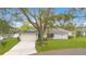 Charming single-story home with well-manicured lawn and mature trees in a peaceful neighborhood at 4029 Cool Water Ct, Winter Park, FL 32792