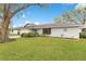 Charming single-story home with well-manicured lawn and mature trees in a peaceful neighborhood at 4029 Cool Water Ct, Winter Park, FL 32792