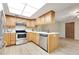 Well-lit kitchen with stainless steel appliances, including stove and dishwasher at 4029 Cool Water Ct, Winter Park, FL 32792