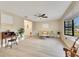 Bright living room boasts wood floors, a ceiling fan, and a bay window that floods the space with natural light at 4029 Cool Water Ct, Winter Park, FL 32792