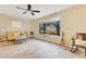 Bright living room featuring neutral paint, laminate flooring, a ceiling fan, and a large bay window at 4029 Cool Water Ct, Winter Park, FL 32792