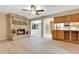 Inviting living room with a stone fireplace and light, modern flooring at 4029 Cool Water Ct, Winter Park, FL 32792