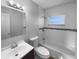 Renovated bathroom with subway tile, a modern vanity, updated fixtures, and a bathtub with shower at 424 N Powers Dr, Orlando, FL 32835