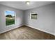 Comfortable bedroom with neutral carpet and natural light from two windows at 424 N Powers Dr, Orlando, FL 32835