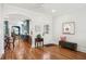 Open dining area with hardwood floors, leading into a stylish kitchen and sunlit breakfast nook at 428 Highland Ave, Orlando, FL 32801