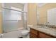 Bathroom with a shower and bathtub, featuring a granite countertop at 4414 Azure Isle Way, Kissimmee, FL 34744