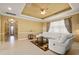 Spacious living room featuring a coffered ceiling, neutral paint and a comfortable white sofa at 4414 Azure Isle Way, Kissimmee, FL 34744